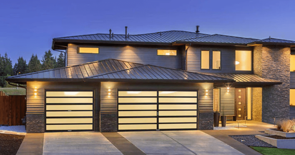 Modern home with glass panel garage doors.