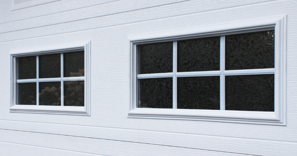 White garage door with two small windows.