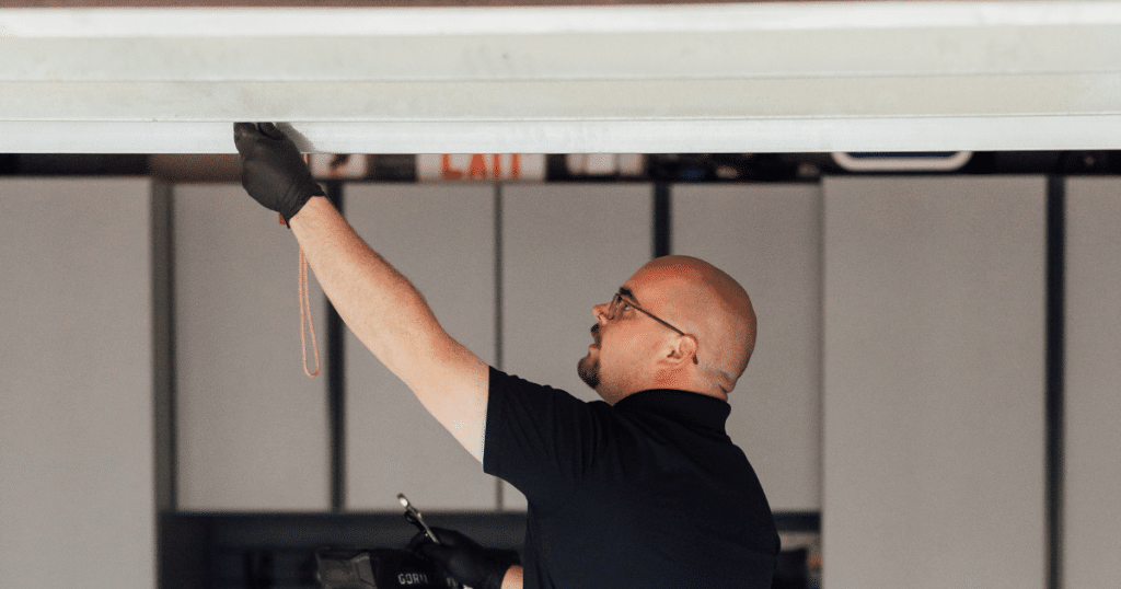 Is it cheaper to repair or replace a garage door?