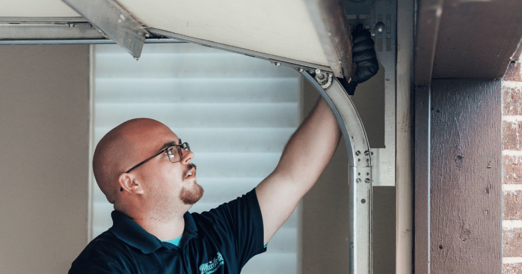 Is it cheaper to repair or replace a garage door?