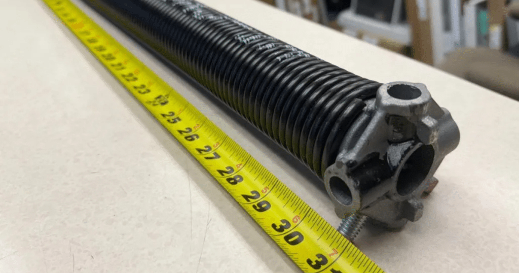 How do I open my garage door if the spring is broken?